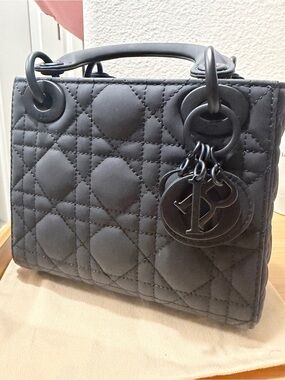 Matte Black Quilted Top-Handle Bag with Charm Accents
